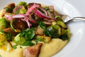 Roasted Brussels Sprouts with Spicy Sausage and Pickled Red Onion Recipe